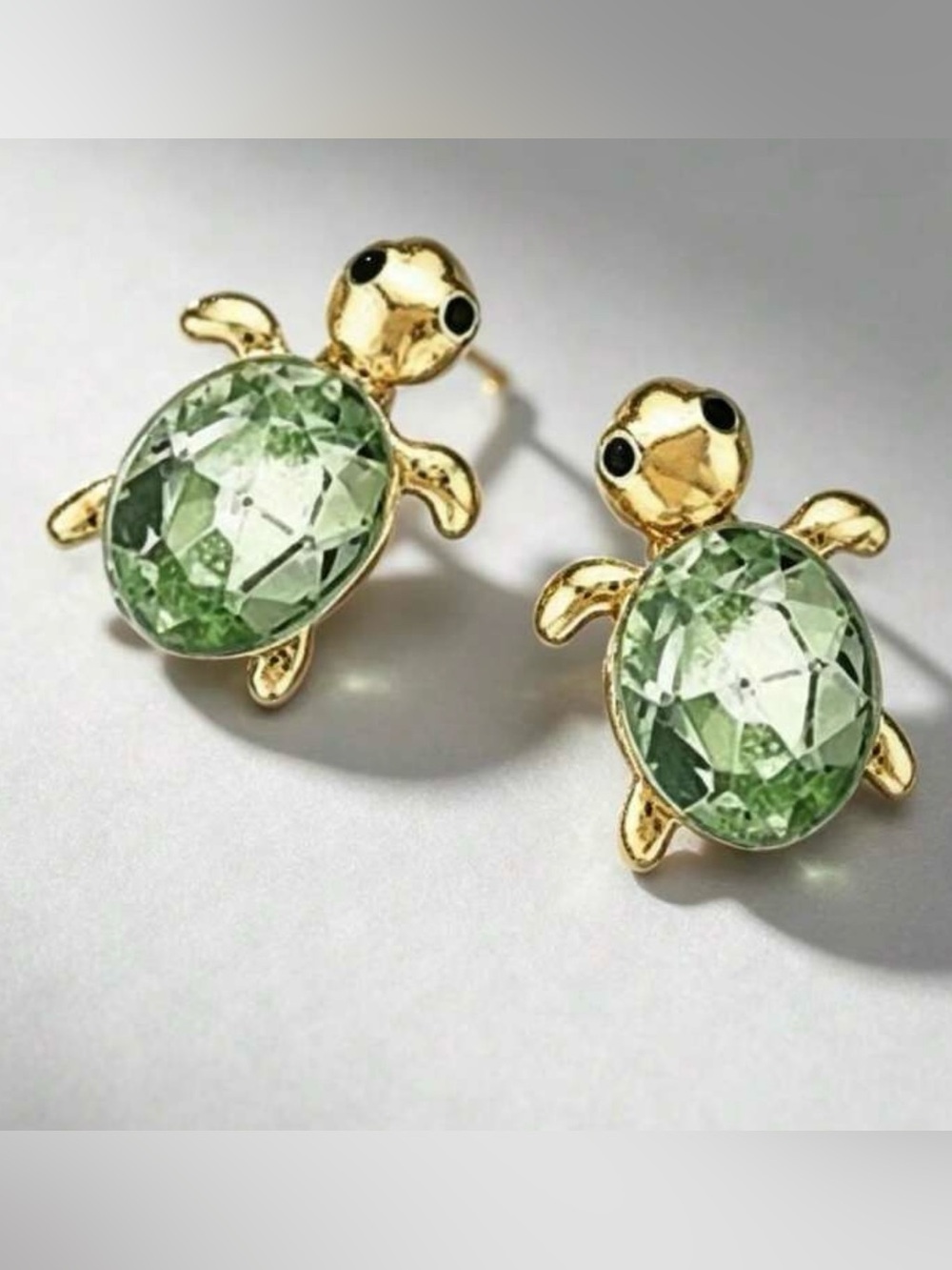 Gold Tone Turtle Stud Earrings with Light Green Gemstones